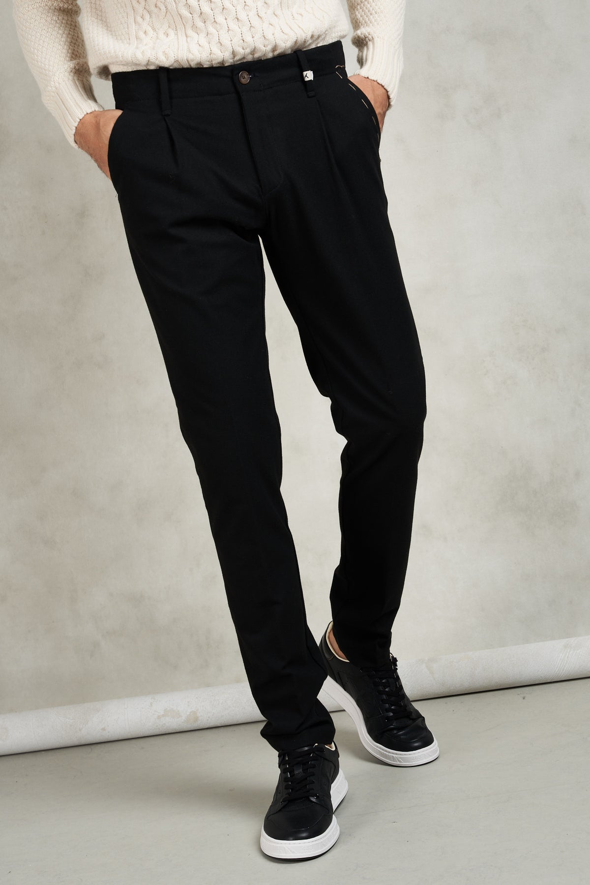 Trousers with side welt pockets